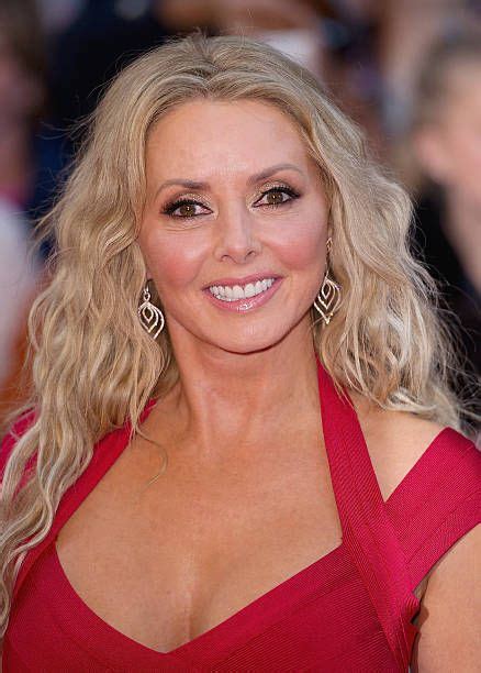 Carol Vorderman Distracts From Her New Blonde Do As She Pours Herself Into A Very Tight Dress