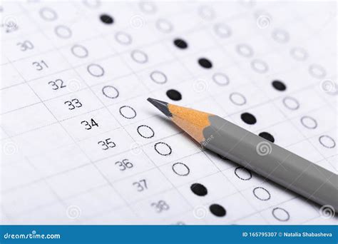 Testing In Exercise And Exam Paper Computer Sheet With Pencil In