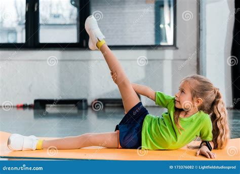 Selective Focus Of Kid Raising Leg Stock Photo Image Of Childhood