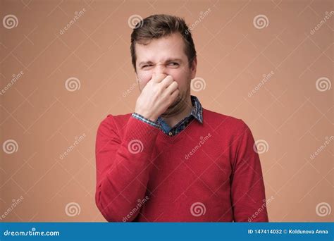 Man Plugs Nose As Smells Something Stink Stock Photo Image Of