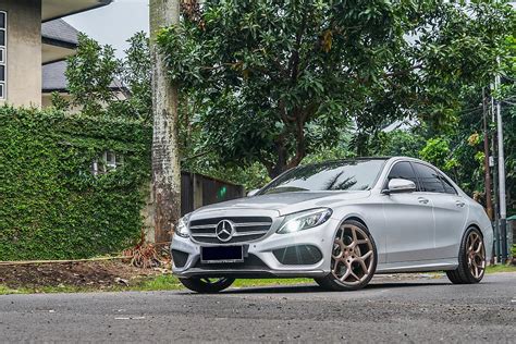How to video taking my mercedes c250 from a single tip exhaust and upgrading/converting/installing to a quad tip setup. Mercedes-Benz C-Class C250 W205 Silver with Vossen CG-205 Aftermarket Wheels | Wheel Front
