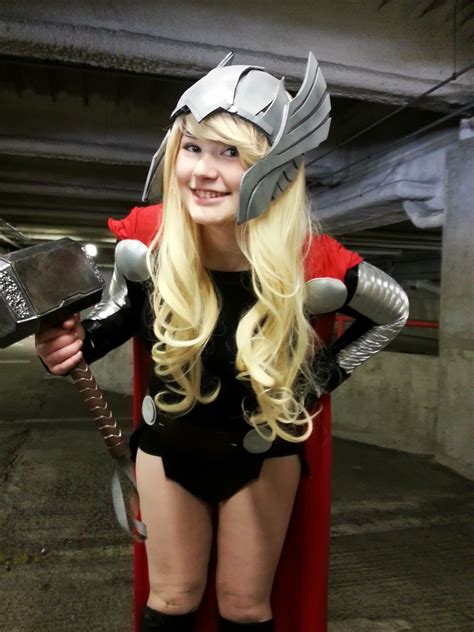 A Woman Dressed As Thor From The Movie Thor Is Posing For A Photo In