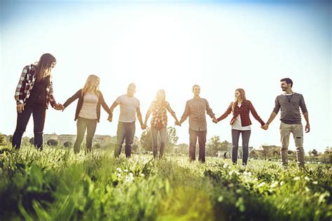 Top Group Of People Holding Hands Stock Photos Pictures And Images