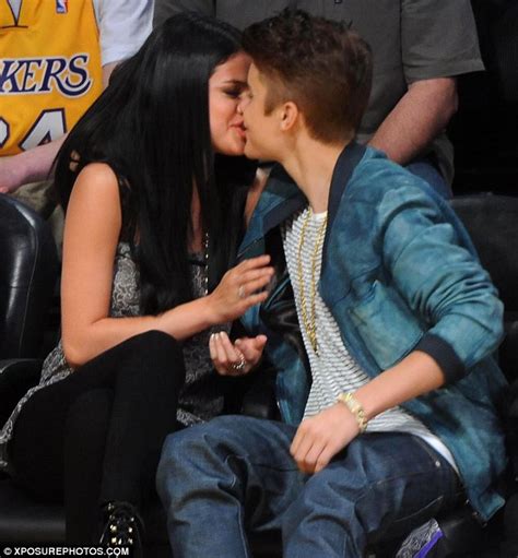 justin bieber spotted kissing selena gomez as she sits on his lap during romantic salt lake city
