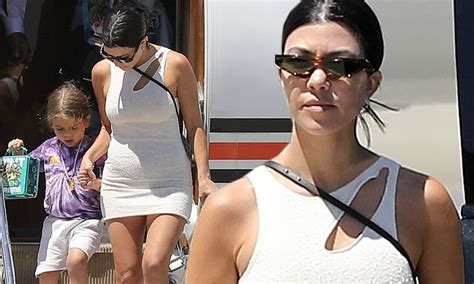 Kourtney Kardashian Shows Off Trim Figure In Contoured Dress As She