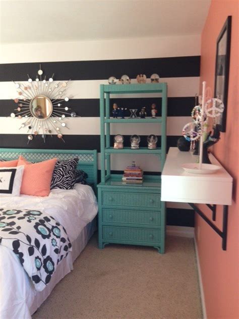 Black accessories and white bedlinen add an elegant feel to this room. Girl's Teal & Coral Bedroom
