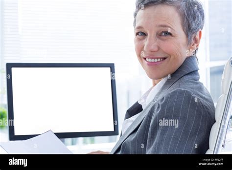 Portrait Of Smiling Businsswoman Using Computer Stock Photo Alamy