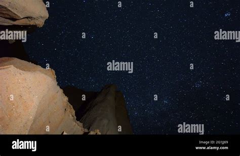 Astro Time Lapse Of Stars Over Canyon Walls In Mojave Desert Vertical