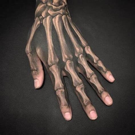 50 Incredible Skeleton Hand Tattoo Designs With Meaning 2022