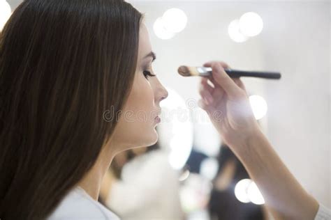 Professional Make Up Artist Doing Make Up In Beauty Salon Stock Photo