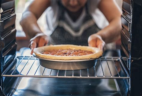 I like to cook the chicken on a metal rack over a baking sheet to allow even heat and continuous airflow on all sides. Baking Pecan Pie In The Oven For Holidays Stock Photo - Download Image Now - iStock