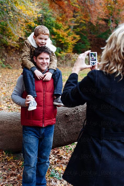 A Woman Takes A Photo Of Her Husband And Son By Stocksy Contributor Holly Clark Stocksy