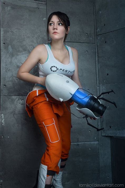 A Woman In An Orange Pants And White Tank Top Holding A Blue And White Blow Dryer