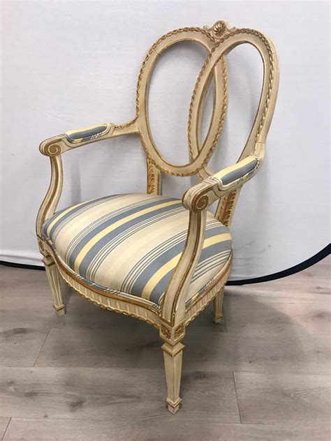Antique armchairs, either upholstered or otherwise, occasionally available as sets for formal use. Pair of Antique French Cream Painted Giltwood Armchairs ...