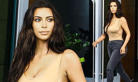 Kim Kardashian Shows Off Her Curves As She Goes Braless In A Skintone