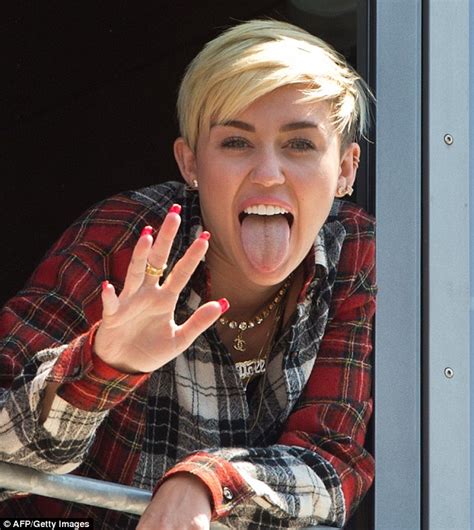 Miley Cyrus Flashes Bra As She Visits London Daily Mail Online
