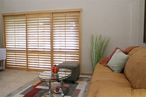 This is available in various themes such as classy, traditional and contemporary looks. Plantation Shutters For Your Living Room - Traditional ...