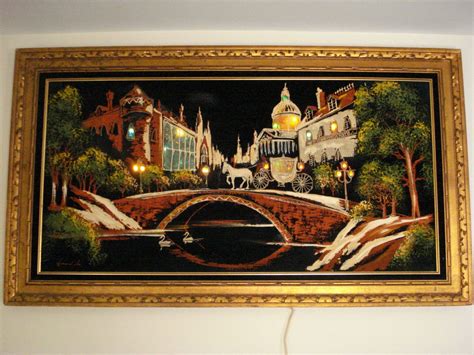 A Painting Is Hanging On The Wall Above A Lamp Post And A Bridge Over A