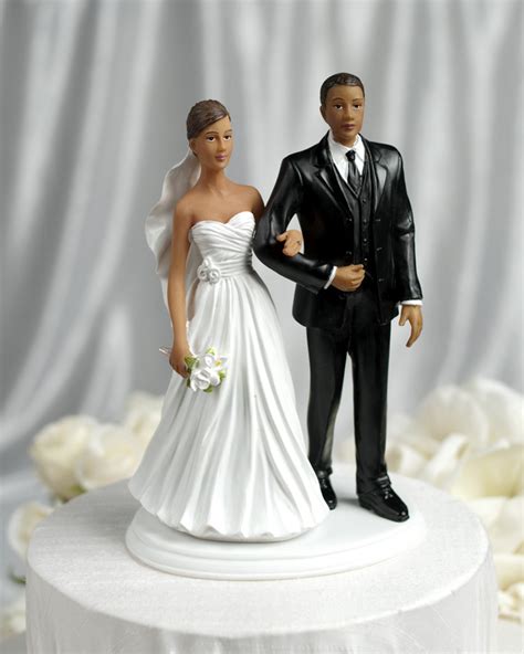 This lovely fine porcelain wedding cake topper shows the bride and groom sharing an take a look at my other 'wedding cake toppers' for a larger selection. Interracial Wedding Couple - Multiple Ethnicities
