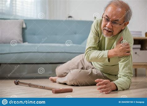 Asian Senior Man Falling Down Lying On Floor At Home Alone With Wooden