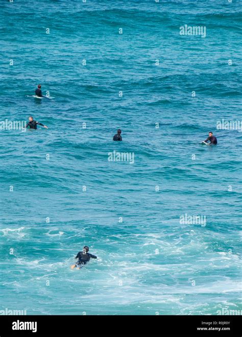 Surfers Catching A Wave At Bronte Beach Sydney Nsw Australia Stock