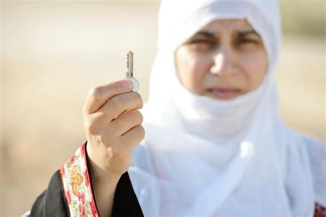 Premium Photo Desperate Arabic Woman On Middle East Holding Key Of Lost Home