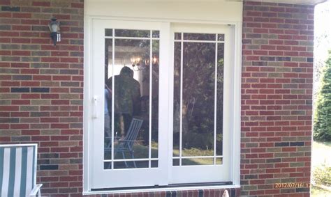 Storm doors can have interchangeable glass and screen panels. Pella French sliding door in Moon, PA | Double screen ...