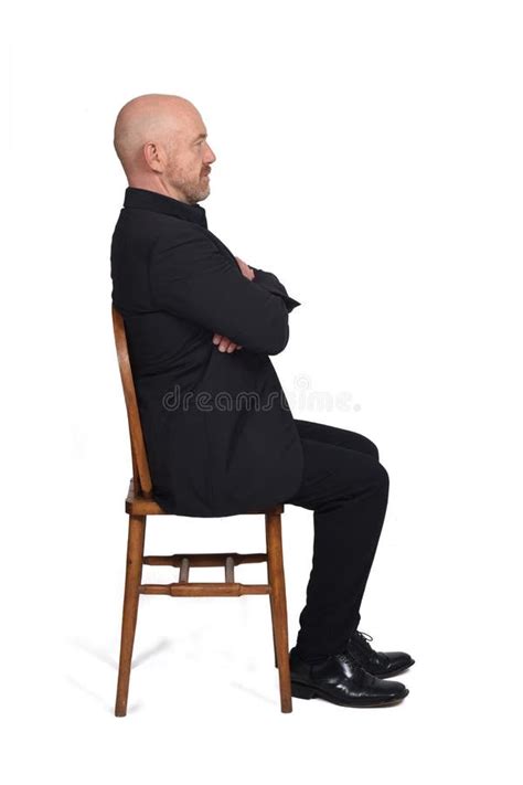 Portrait Of A Man Sitting On A Chair Side View On White Background