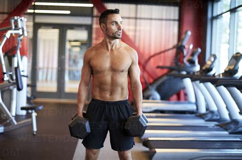 A Man Working Out In The Gym Stock Photo