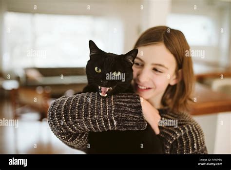 Girl Holding Black Cat Hi Res Stock Photography And Images Alamy