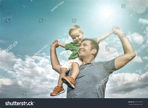 Son Seating On Father Under Beautiful Stock Photo 221519233 Shutterstock