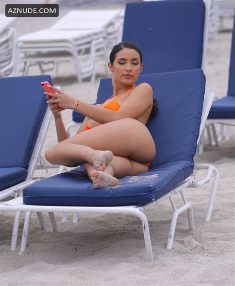 tao wickrath sexy wearing the bright orange bikini and later relaxed in her sun lounger on the