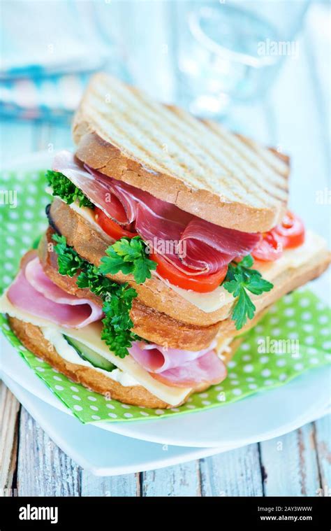 Toasted Cheese And Ham Sandwich With Crisps And Salad Hi Res Stock