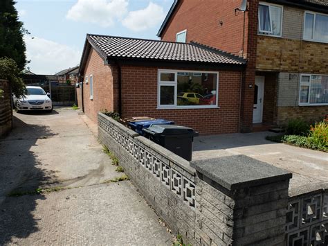 Matching feature stepped brickwork to the existing house manufacture of hardwood windows to match the existing house design & style raising garage floor, to create level floor throughout the house Double Garage Conversion to a Four Room Apartment