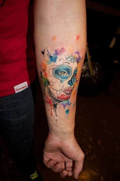 The sugar skull tattoos or calavera in mexican language denotes to the human skull which is a popular figure in mexico and they are made up of sugar or clay. Blue eyes watercolor skull tattoo