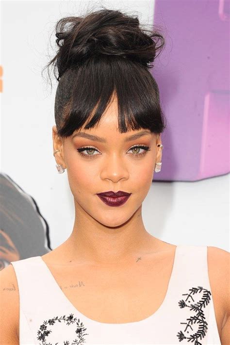 Rihannas Hair Was Styled In A Messy Bun With A Full Fringe For The Los