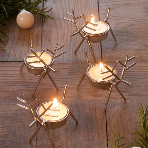 set of four reindeer tea light holders by retreat home | notonthehighstreet.com