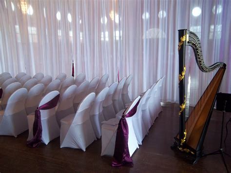 Indoor Wedding Ceremony With Draping White Spandex Chair