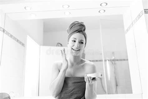 Young Woman In The Bathroom Looks Into A Mirror Stock Image Image Of Attractive Beautician