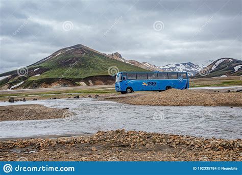 Highland Off Road Bus Is Crossing A River Near Major Campsite In