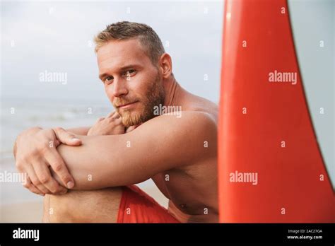 Image Of A Cheery Positive Strong Handsome Man Surfer With Surfing On A
