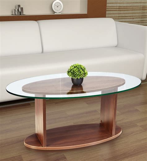 It's distinctive curved legs support tempered safety glass and a frosted lower shelf. Buy Oval Shaped Glass Top Coffee Table in Walnut Finish by ...
