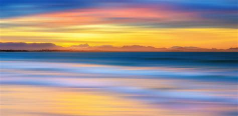 Tranquil Ocean Vibrant And Tranquil Scenery Of Sunset At T Flickr