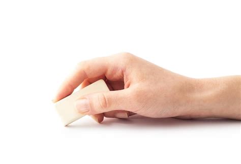 Premium Photo Eraser Tool In A Hand Isolated On White