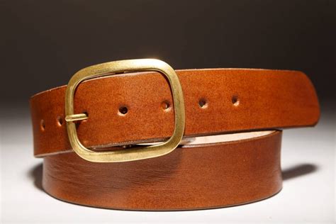 One of the few accessories that are always present in the wardrobe of men is a belt with a good buckle. Brown Leather Belt with Brass Buckle - Regan Flegan