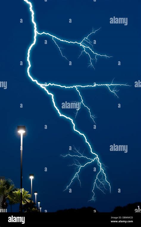 Lightning Bolt In Night Sky Over Street Lights Stock Photo Alamy