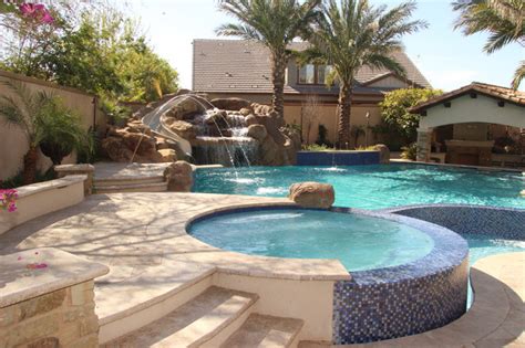 Backyard Oasis Pool Spa Swim Up Bar Grotto Slides And Water Features Mediterranean Pool