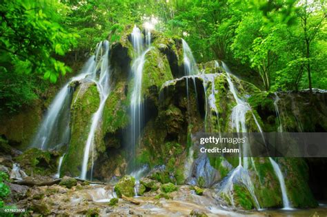 Cascade Falls Over Mossy Rocks In Forest High Res Stock Photo Getty