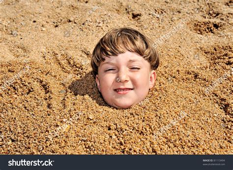 Head Of A Boy Buried In The Sand Stock Photo 81113494 Shutterstock