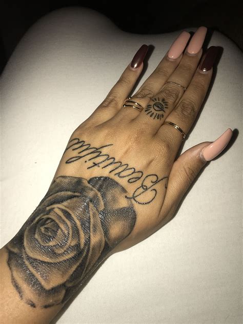 Add a delicate shine to your skin with this sophisticated new jewel tattoo. Rose hand tattoo | Rose hand tattoo, Henna tattoo designs ...
